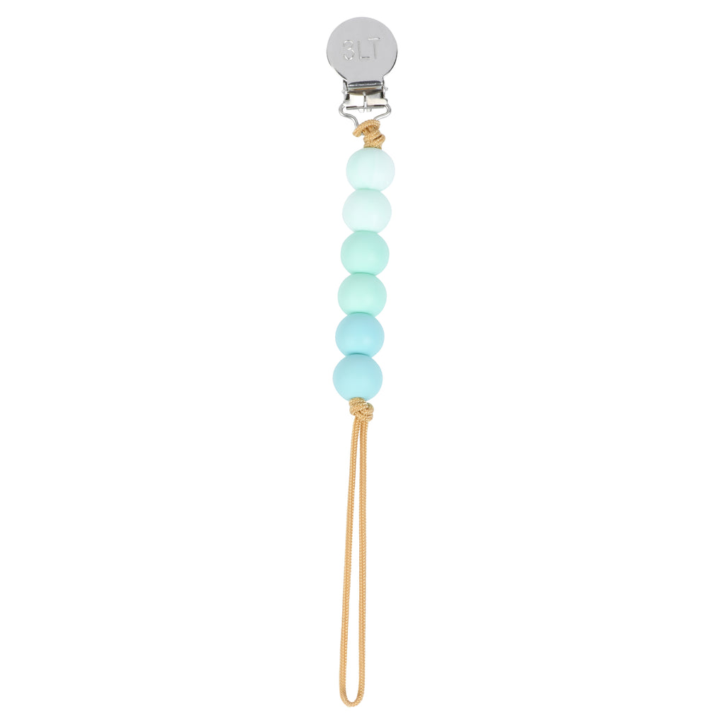 Three Little Tots silicone beaded pacifier clip in a turquoise ombre pattern. These clips are handmade in the USA.