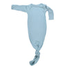 Designed for day or night, this tie-bottom outfit ensures easy diaper changes and gentle dressing.